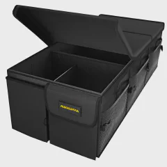 MIKKUPPA 95L foldable trunk organizer in a van cargo area, lid closed, two adjustable straps anchored to tie-down points